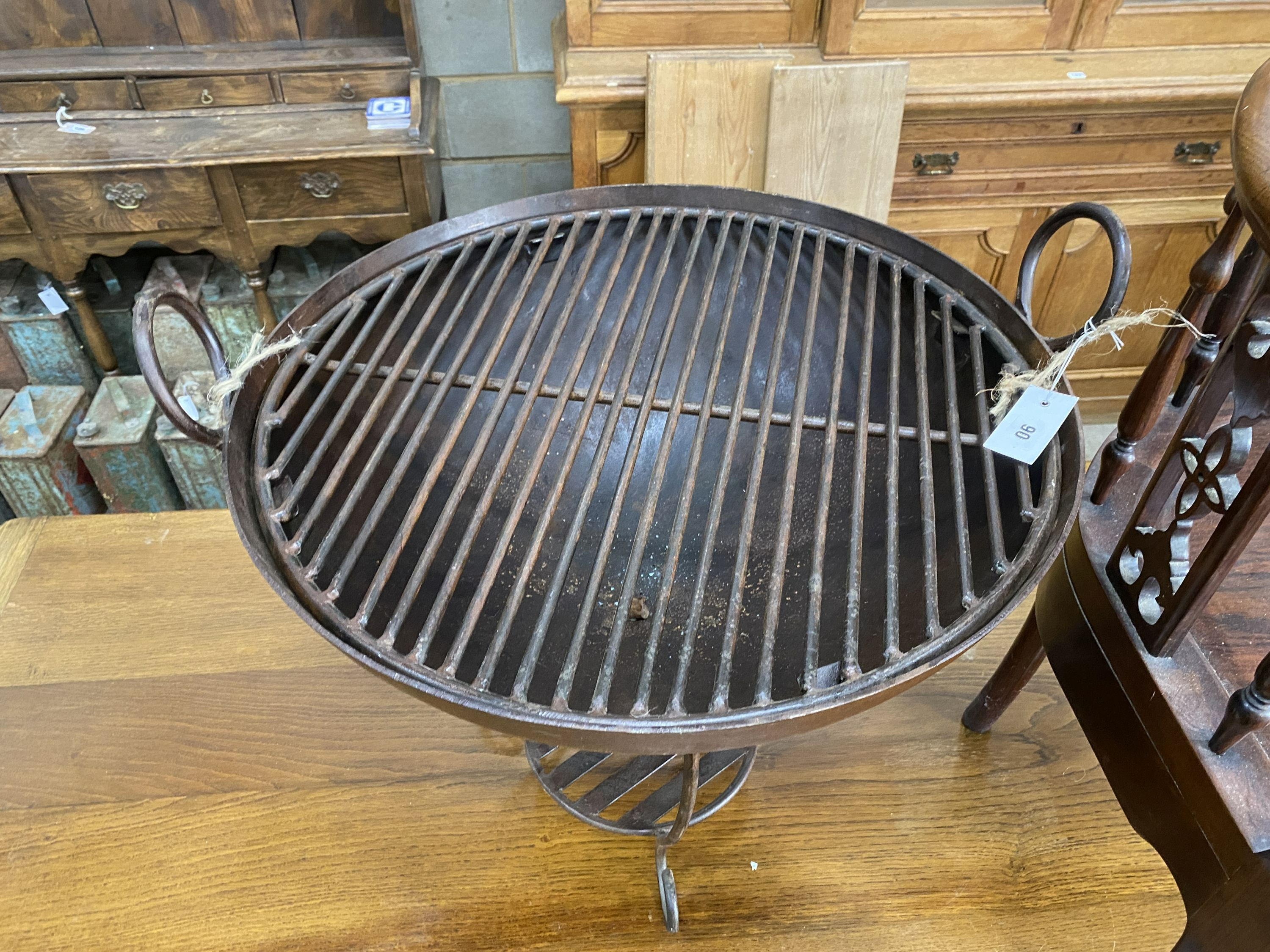 A wrought iron fire pit, diameter 61cm, height 57cm